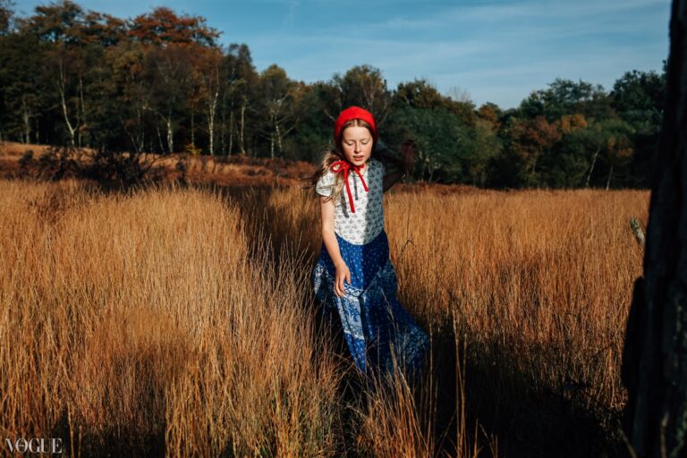 Bonnets for winter in long grass; Childrens portrait photographer in London, Surrey and Kent